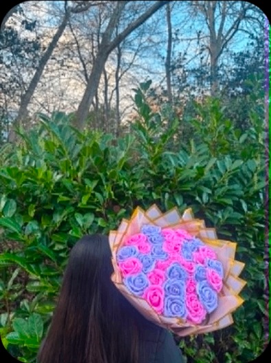 Handheld lilac and pink rose bouquet