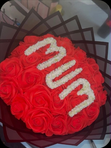 Red rose bouquet spelling MUM in white roses